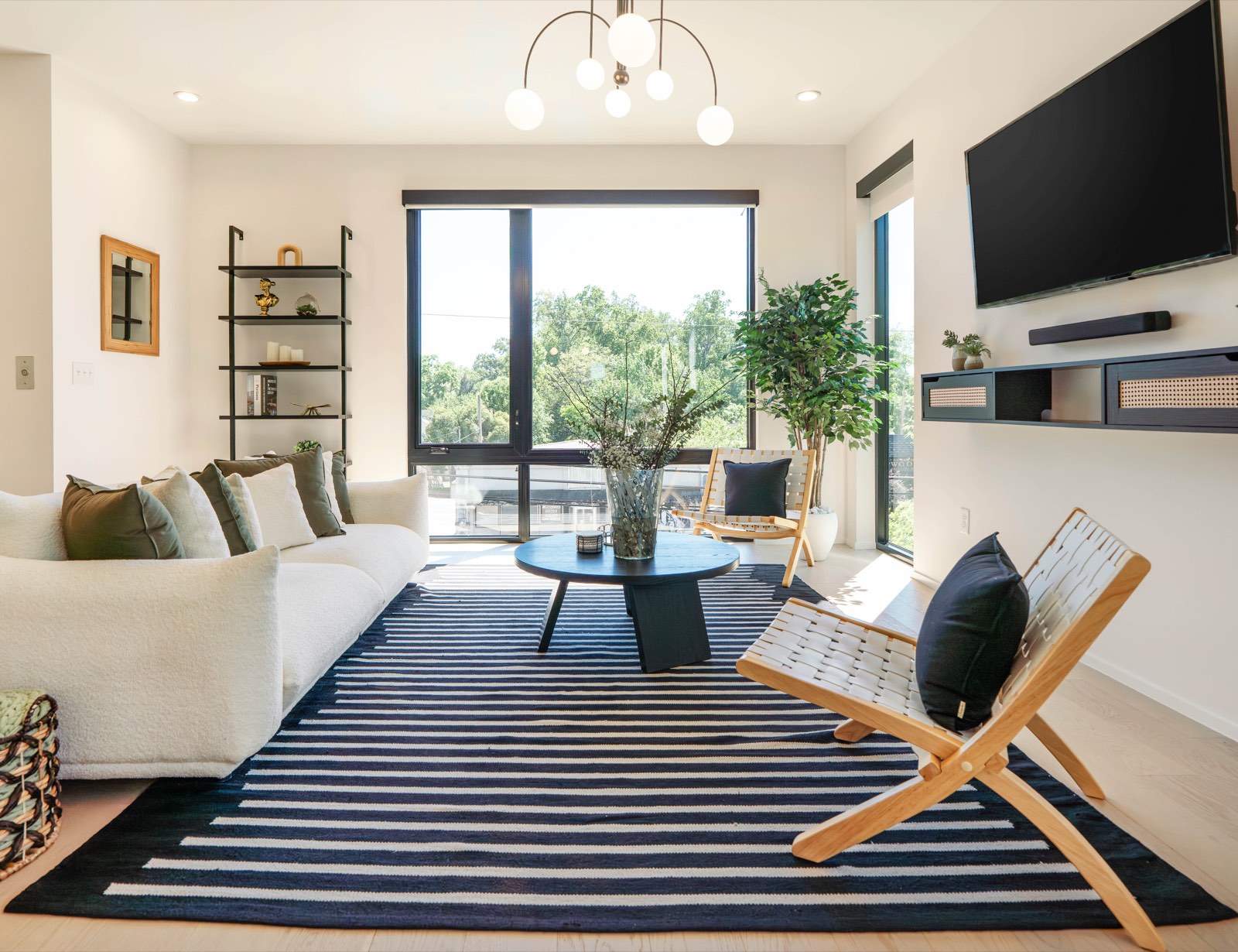 Contemporary living room with striped rug and folding accent chair